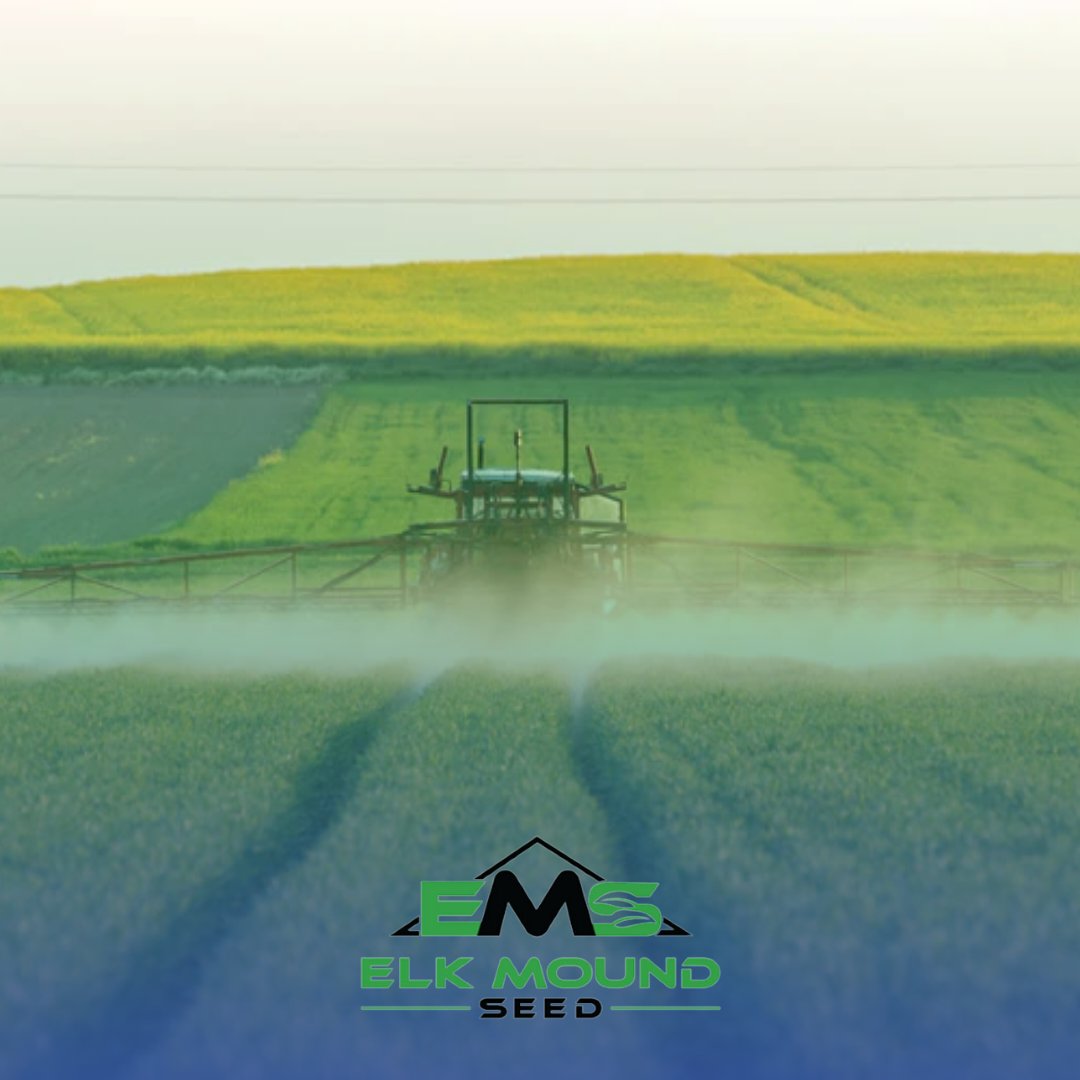 tractor spraying fertilizer chemicals in a field